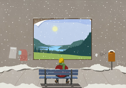Man on snowy city bench looking at scenic rural billboard