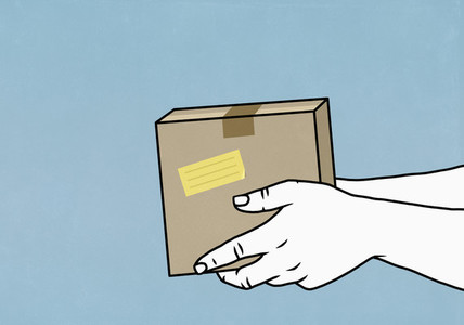 Hands holding cardboard box parcel