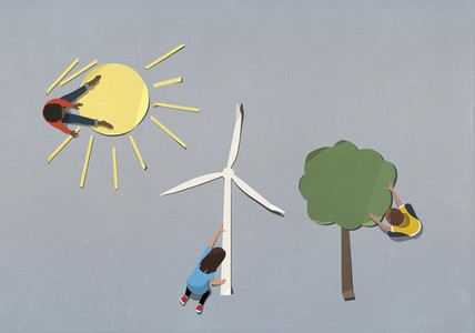 Kids arranging environment and wind turbine paper symbols