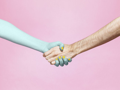 Abstract handshake on pink background