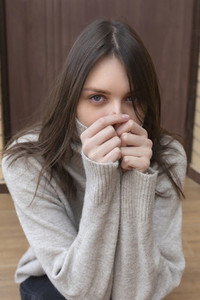 Portrait beautiful young brunette woman in turtleneck sweater