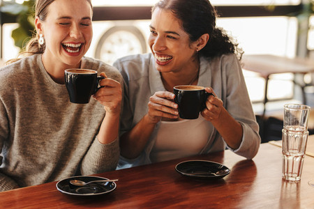 Female friends enjoying a coffee at cafe