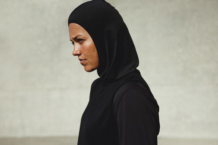 Muslim woman in sportswear outdoors
