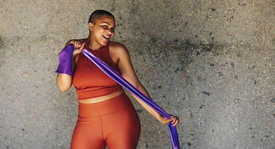 Plus size woman workout with resistance band