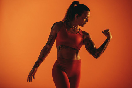 Monochrome portrait of a muscular female bodybuilder