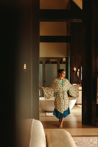 Woman walking inside a luxury hotel