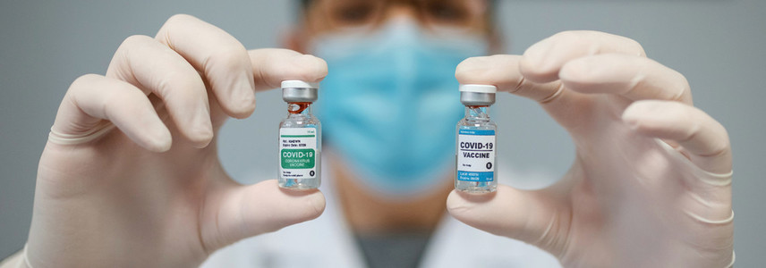 Doctor showing two coronavirus vaccine options