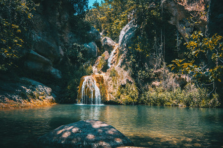 landscape of a small waterfall in a forest of tarragona  spain