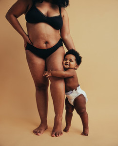 Plus size mom with her baby