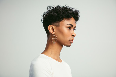 Gender fluid man with earring