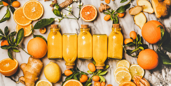 Immune boosting turmeric  ginger  citrus juice shot in bottles