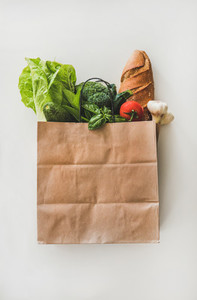 Online grocery healthy food shopping in paper bag  top view