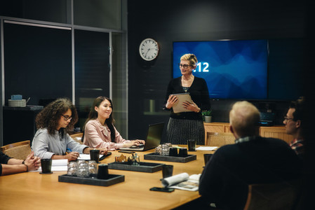 Female manager addressing her team at a meeting