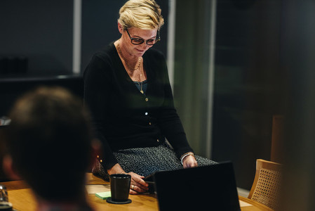 Businesswoman with digital tablet in meeting room