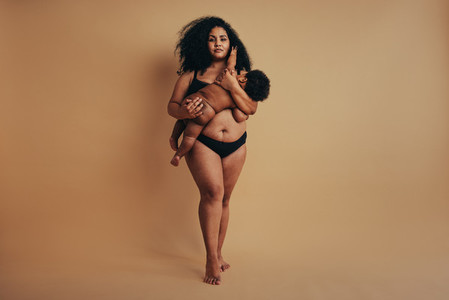 Plus size mother with her infant