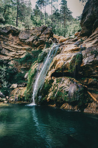 landscape with a pool with waterfall in a place of spain