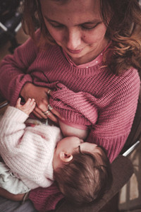 Young woman breastfeeding her baby