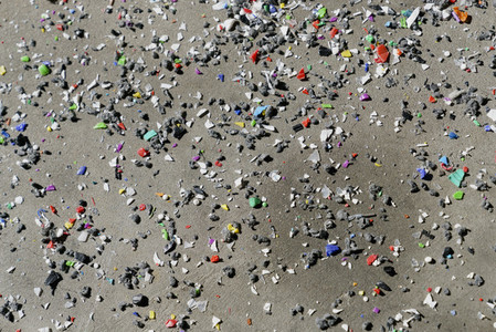 Multicolor glass shards on sand