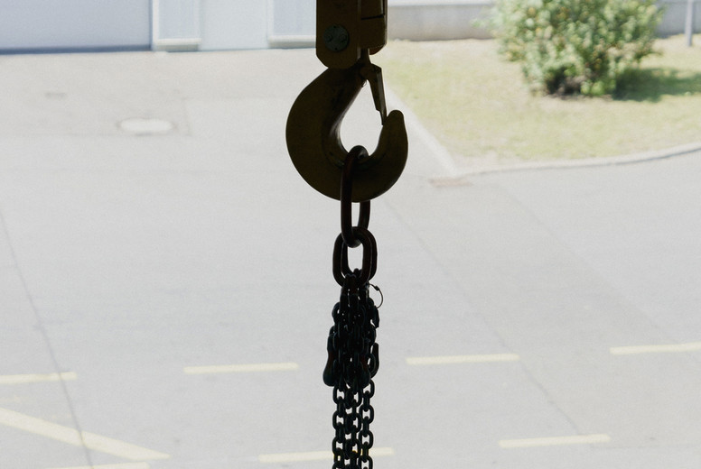 Cable winch hook with chains at loading dock doorway