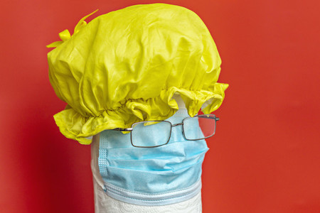 Shower cap protective face mask and eyeglasses forming anthropomorphic face