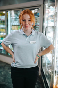 Young worker in supermarket