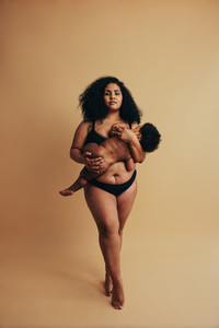 Strong African woman nursing her child