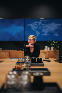 Female entrepreneur taking lead in boardroom meeting