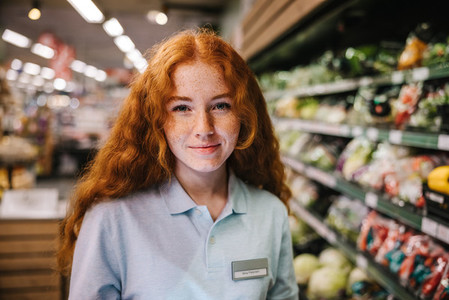 Woman on holiday job at grocery store