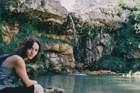 woman next to a waterfall