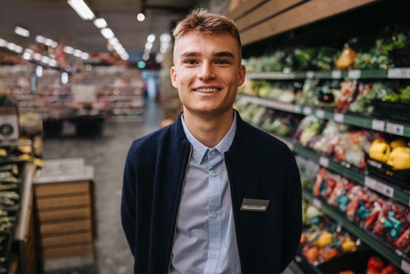 Young grocery store assistant