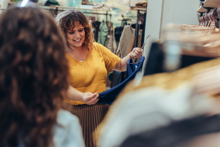 Woman shopping in clothing store