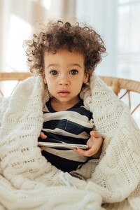 Portrait of a cute little boy with smartphone