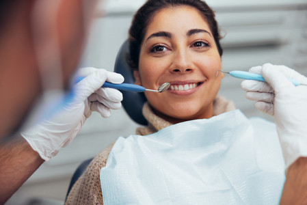Woman having dental checkup in clinic