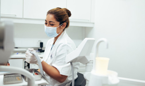 Dentist examining a patients teeth at the dental clinic