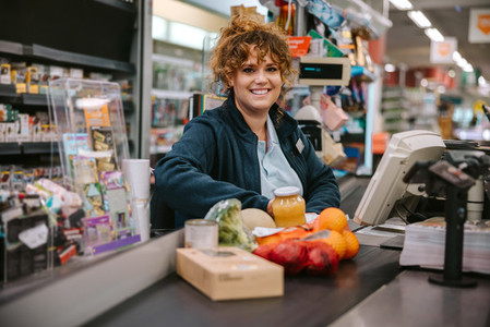 Woman working in modern supermarket