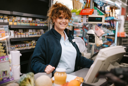 Woman cashier at supermarket