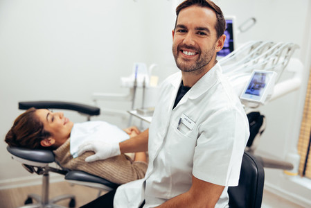 Successful male dentist in his clinic