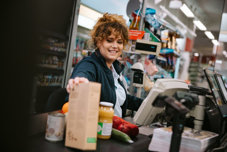 Woman working in modern supermarket