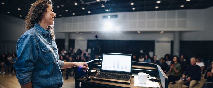 Businesswoman giving a presentation in a corporate event