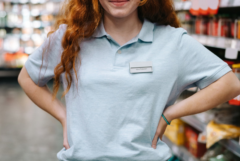 Young worker at supermarket