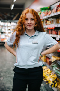 Young worker at supermarket