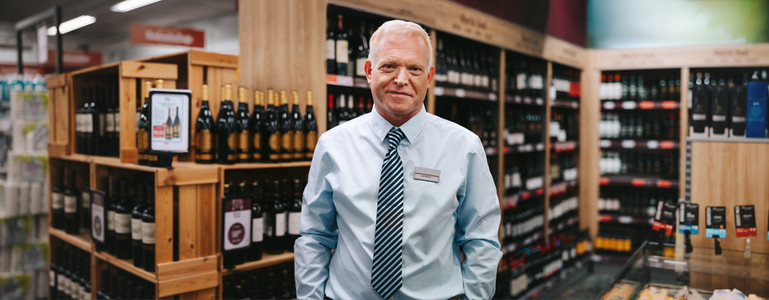 Portrait of a liquor store manager