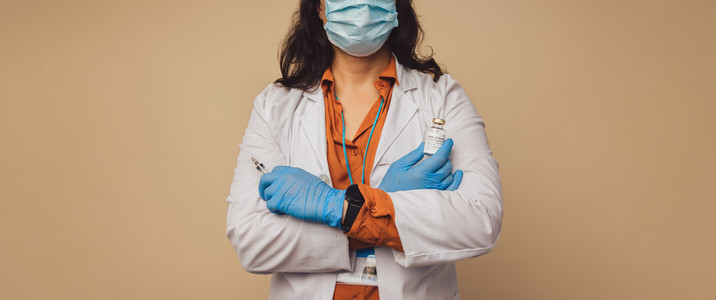 Doctor with a syringe and coronavirus vaccine