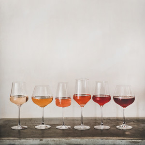 Various shades of Rose wine in stemmed glasses  square crop