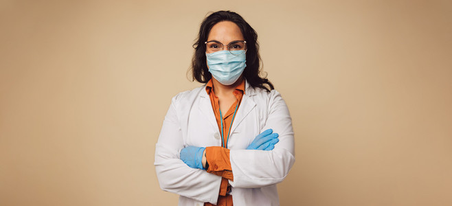 Female doctor with face mask and gloves