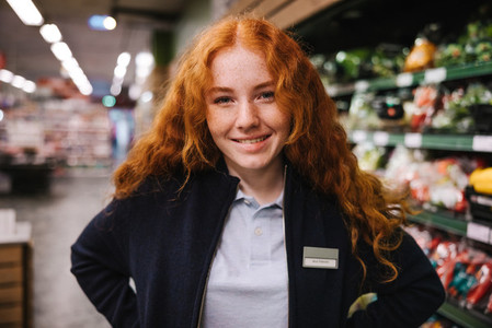 Young employee smiling at camera