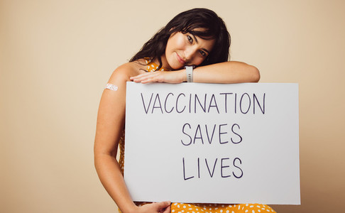 Attractive female with vaccination saves lives banner