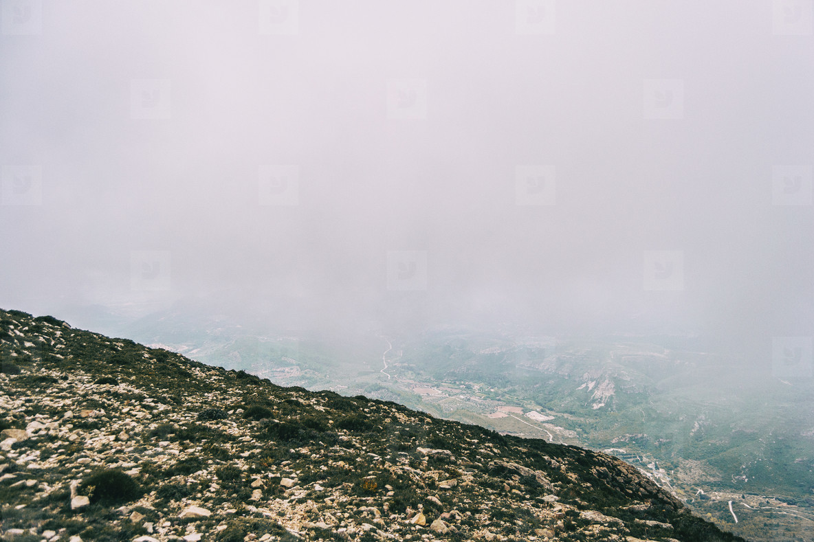 cloudy day with fog in the mountains of the natural park of the ports in tarragona spain