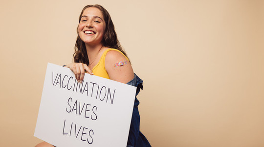 Pretty woman with Vaccination saves lives banner