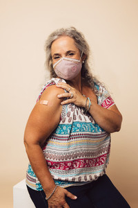 Senior woman getting a covid vaccine